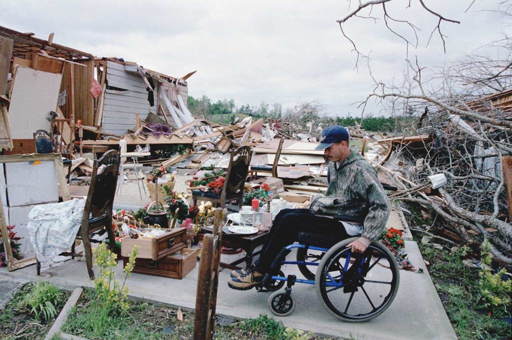 April, 1998 Biringham, Alabama --Victim of an F-5 tornado in Rock Creek subdivision searches for belongings. Photo by Liz Roll